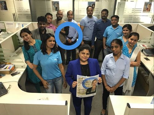 Blue circle app with poster and blue ring in office